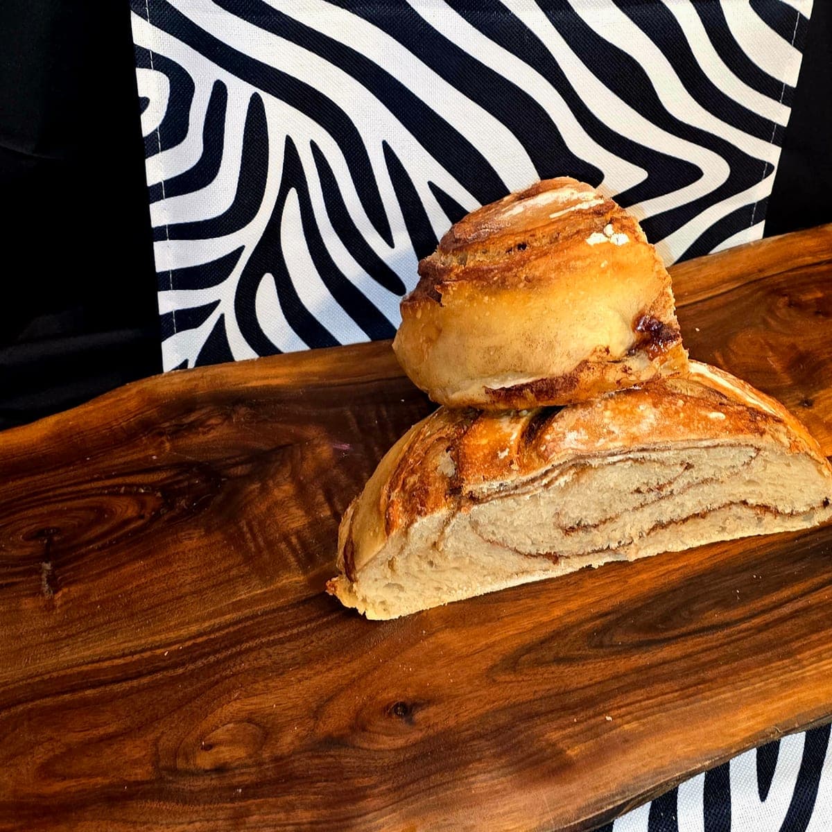 Cinnamon swirl sourdough cut to reveal ribbons of cinnamon through the crumb