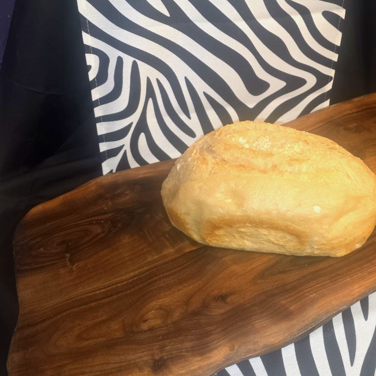Honey oat sourdough loaf topped with toasted rolled oats